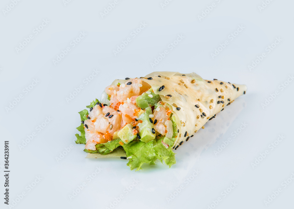 Japanese Temaki Hand Roll Sushi with scallop, flying fish roe (Tobiko