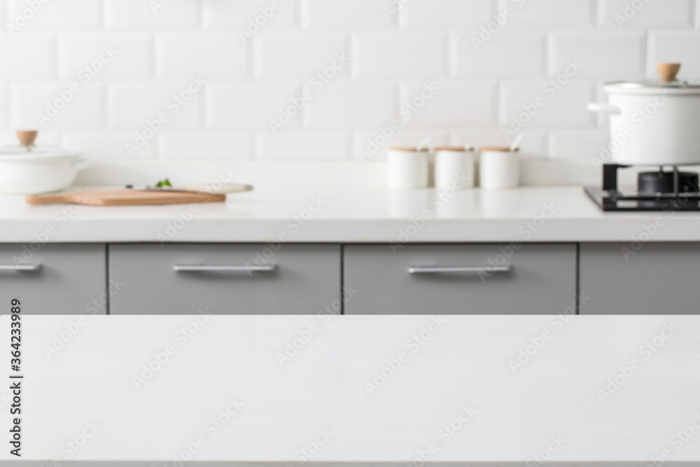 empty marble stone table top and blurred view of kitchen bench background. empty marble stone table top and blurred view of kitchen bench background.