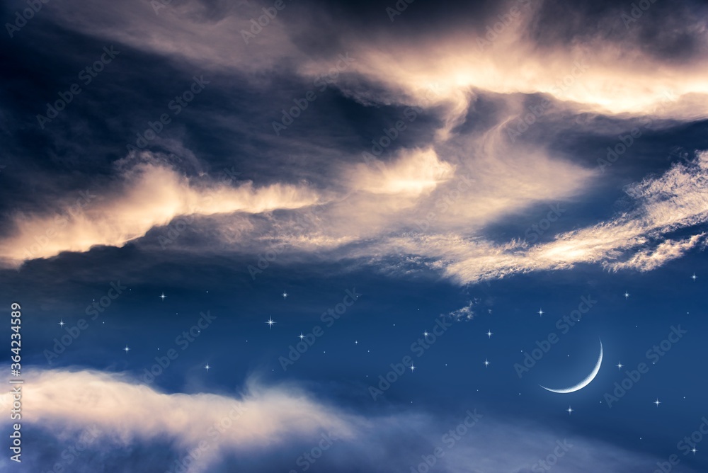 Obraz premium a young month in the clouds. night landscape sky