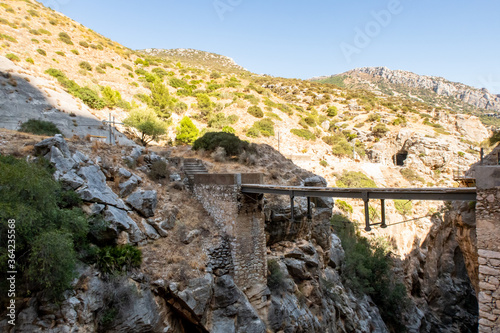 El Caminito del Rey, Spain, old narrow dangerous metal bridge spread between rocks over the precipice at El Chorro gorge. Bridge is destroyed and closed for tourists. 