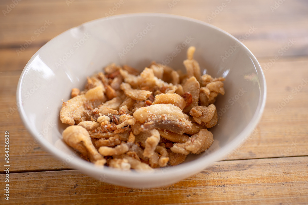 Streaky pork with crispy crackling in bowl Streaky pork with crispy crackling in bowl