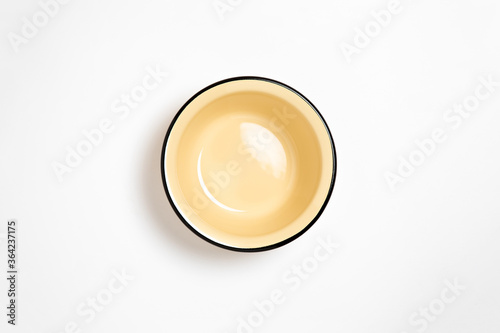 Enamel plate  or bowl  isolated on white background.High-resolution photo.