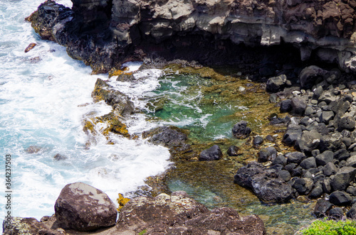 View from top of rock onto Olivine Pools on Maui Island in Hawaii photo