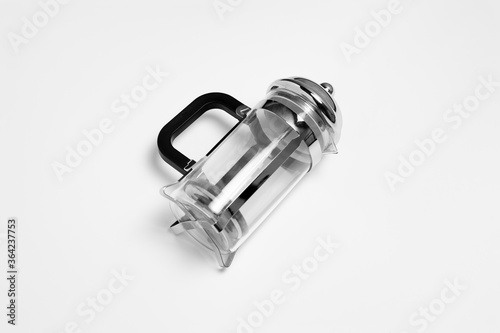Glass transparent teapot with steel infuser isolated on white background.High-resolution photo.