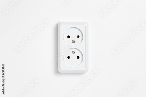A white double socket on white background.Electric plug. European high voltage 220W sockets.High-resolution photo.