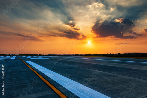 Принти на полотні Runway, airstrip in the airport terminal with marking in sunset background