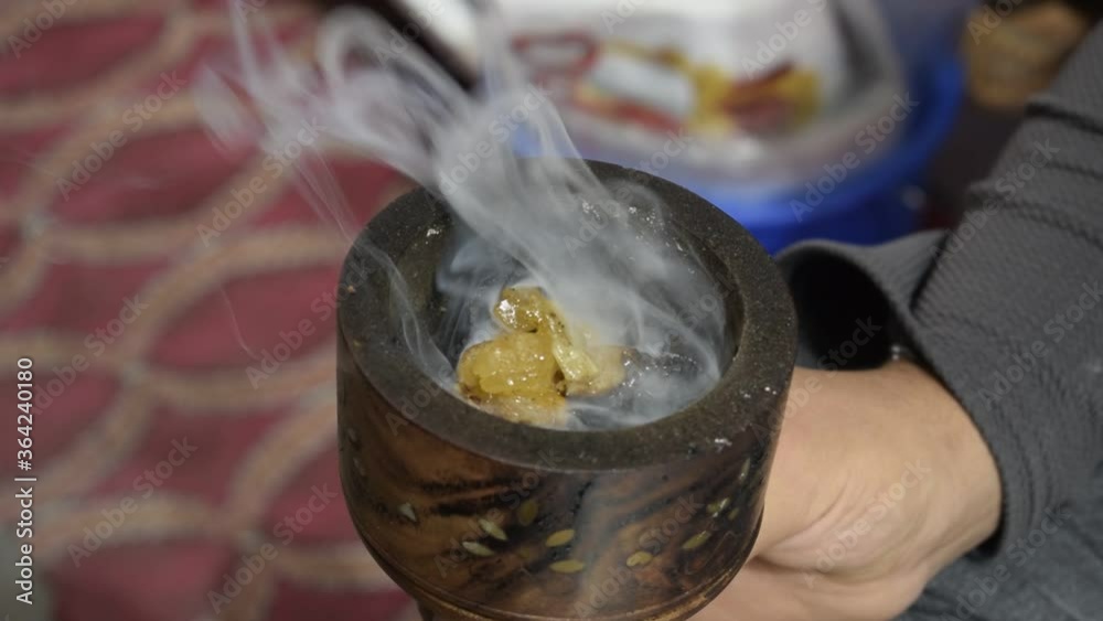 Smoke emitting by burning oud also known as agarwood. It is a very popular and traditionaly used herb in middle eastern country for frangrance. Many other aromatic scent can be used