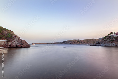 Spain Costa Brava peaceful pebble beach of the Mediterranean sea, Cala Guillola, Cadaques, Cap de Creus, Catalonia © martinscphoto