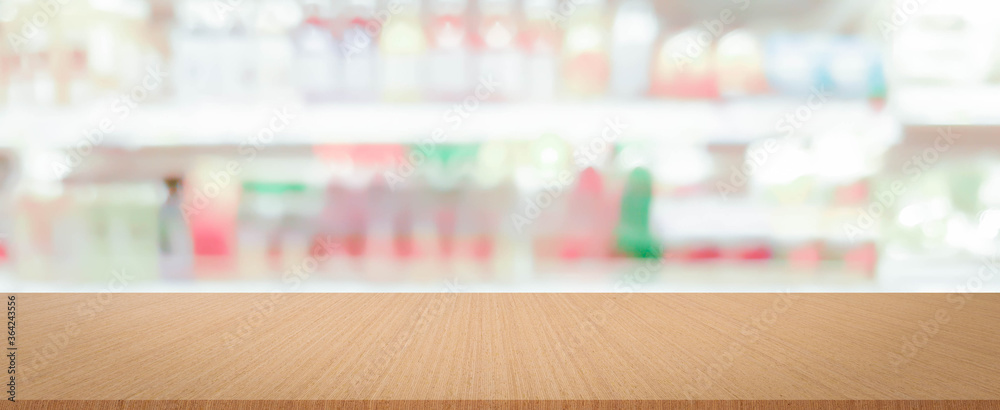 blur local supermarket convenience fresh beverage zone store background with wood perspective tabletop to showing product or ads banner and promote marketing on display concept	