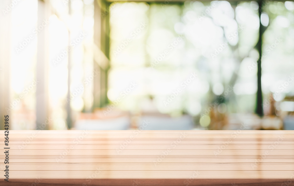 Empty wooden top table with blur coffee shop background Empty wooden top table with blur coffee shop background