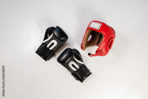 Protective boxing helmet in red to protect the head during a fight in the ring