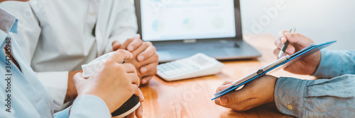 Young couple and real estate Financial Advising agent using laptop on a meeting about Accounting Calculating Cost Economic bills Financial concept