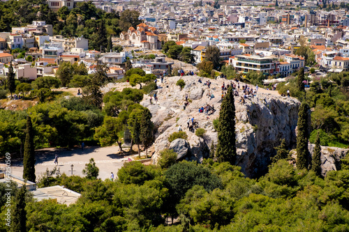 Panoramic view of Areopagus rock - Areios Pagos - seen from Acropolis hill with metropolitan Athens, Greece in background