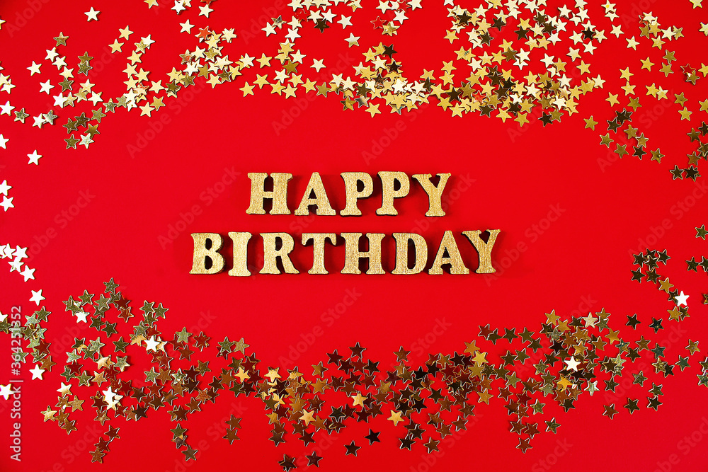 Fototapeta premium Text Happy birthday laid out of gold letters on beautiful background. Golden stars confetti.