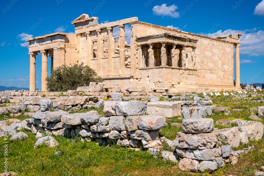 Panoramic view of Erechtheion or Erechtheum - temple of Athena and Poseidon - within ancient Athenian Acropolis complex atop Acropolis hill in Athens, Greece