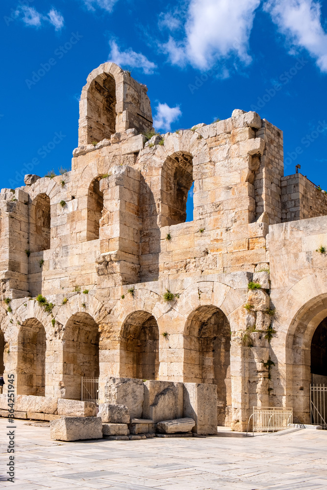 Stone facade and arcades of Odeon of Herodes Atticus Roman theater, Herodeion or Herodion, at slope of Athenian Acropolis hill in Athens, Greece