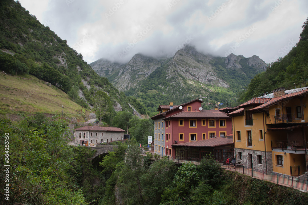 Settlement in the mountains of the Pyrenees on the banks of a fast mountain river.