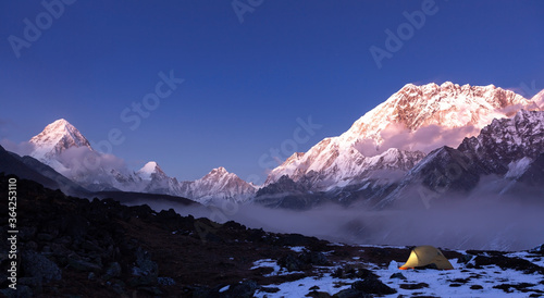 Tent in mountains at night. Himalayan landscape at night on Everest basecamp trek.