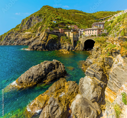 A view towards the station for the Cinque Terre village of Riomaggiore, Italy in the summertime