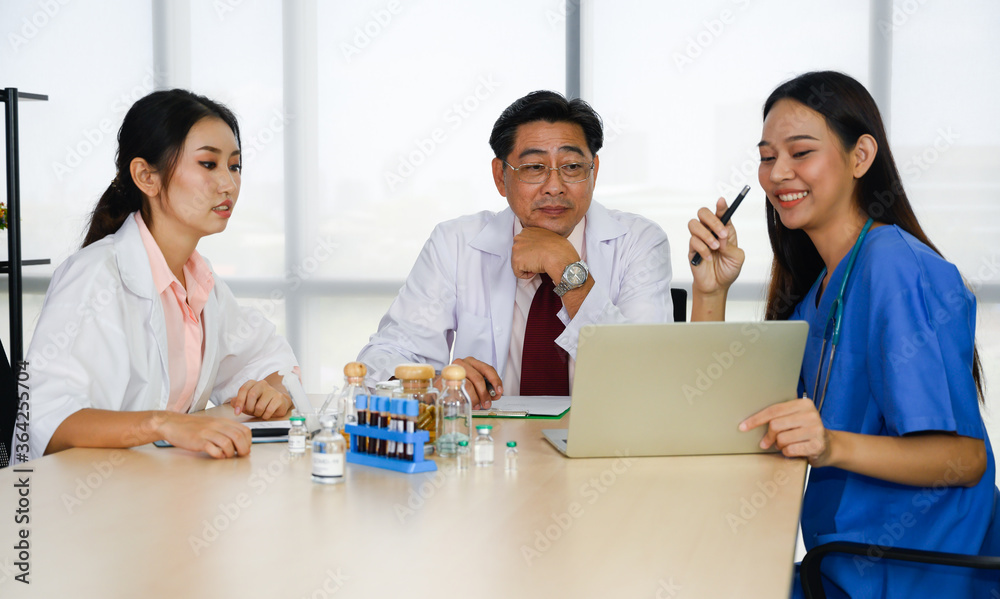 Team of Asian doctors and nurse have a meeting in medical meeting room. Happy meeting in hospital.
