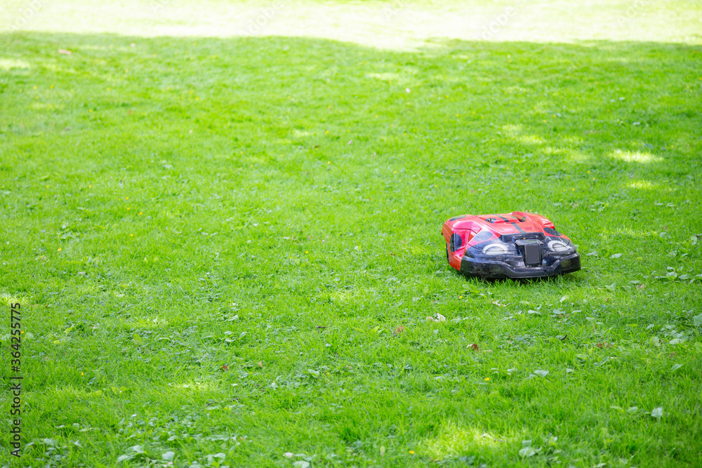 Robotic automatic lawnmower for garden improvement and grass trimming in the yard Robotic automatic lawnmower for garden improvement and grass trimming in the yard