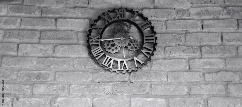 vintage clock on gray brick wall