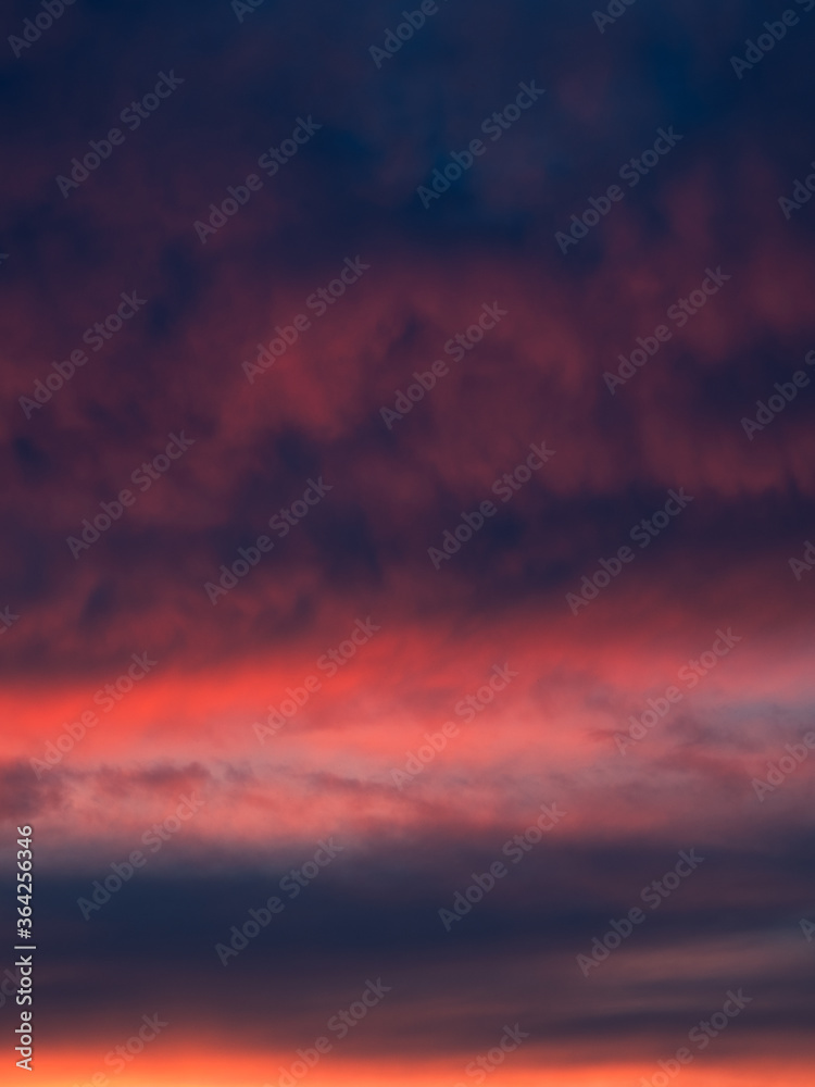 Dramatic sunset with a twilight dark blue color of the sky and clouds. Nature is an abstract composition