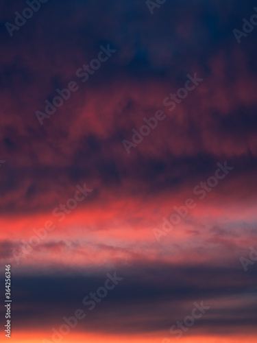 Dramatic sunset with a twilight dark blue color of the sky and clouds. Nature is an abstract composition