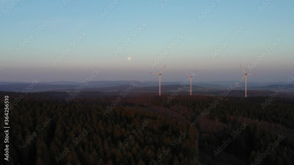 Drone flight over windmills in Lower Saxony landscape, Germany Drone flight over windmills in Lower Saxony landscape, Germany