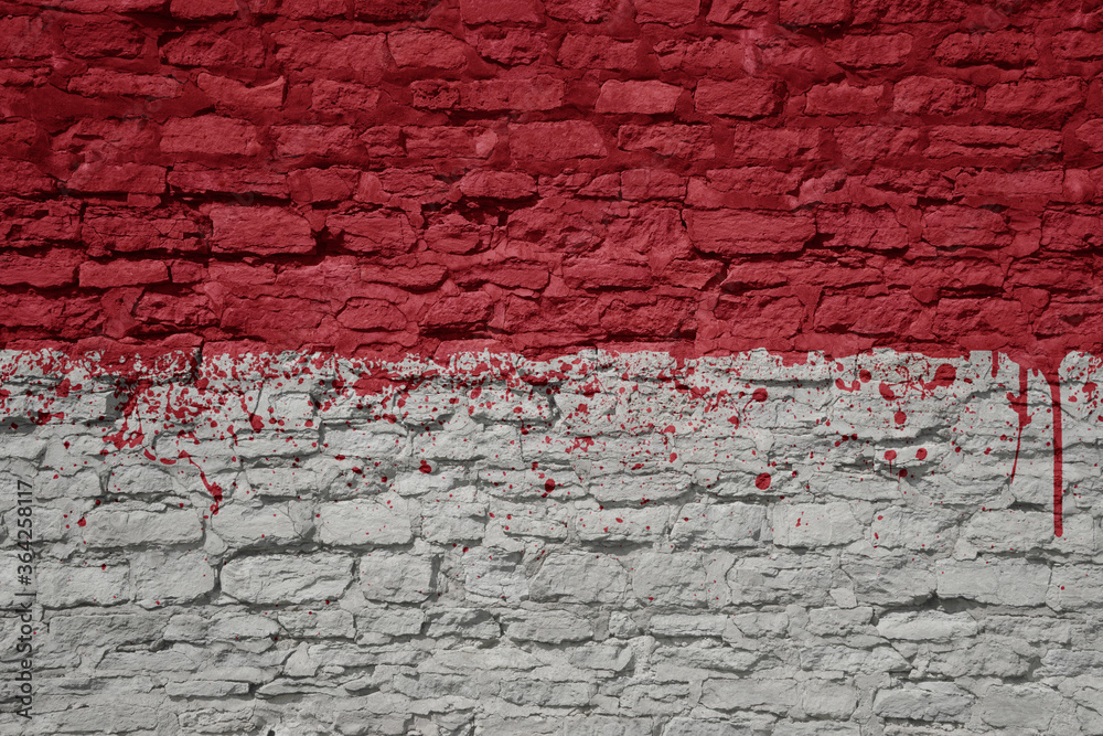 painted big national flag of indonesia on a massive old brick wall painted big national flag of indonesia on a massive old brick wall