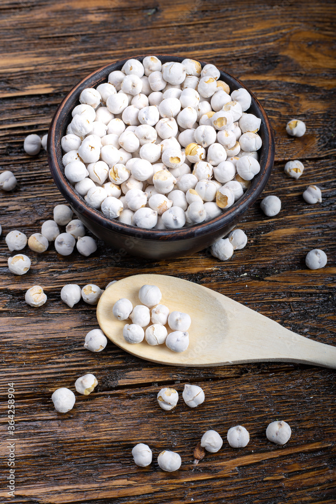 raw chickpeas on wooden background raw chickpeas on wooden background
