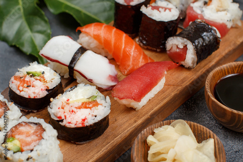 Sushi Set nigiri and sushi rolls on a wooden tray