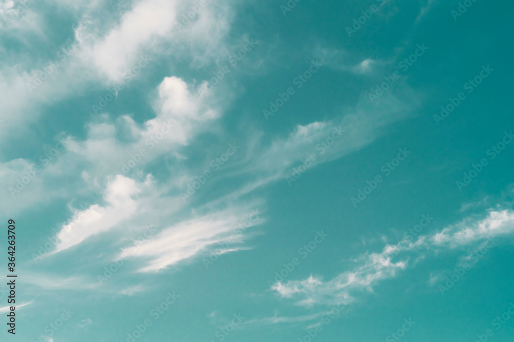 Beautiful white clouds against the blue sky, turquoise filter.. Beautiful white clouds against the blue sky, turquoise filter..