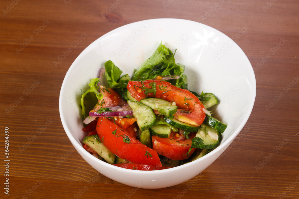 Vegetable salad with tomato, cucumbers