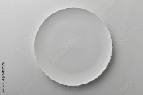 Top view shot of white circular plate.