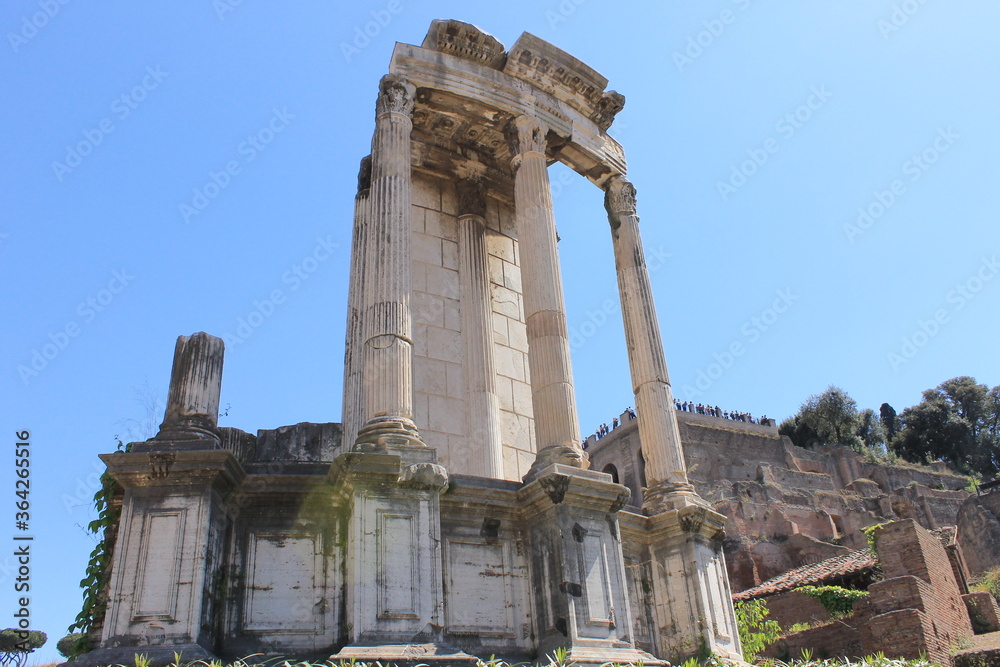 In the ancient city of Rome stands the temple of Saturn.