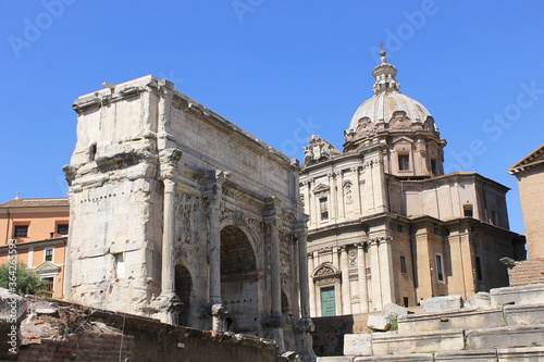 In the ancient city of Rome stands the temple of Saturn.