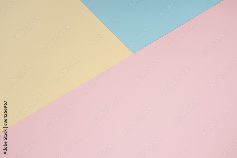 Obraz premium Abstract geometric color paper background. Minimalistic shapes and lines in pastel rose, blue, yellow colours. Copy space backdrop for your design or text, wedding greeting, postcard, brochure