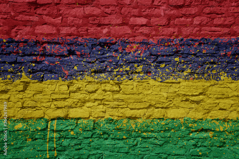 Fototapeta premium painted big national flag of mauritius on a massive old brick wall