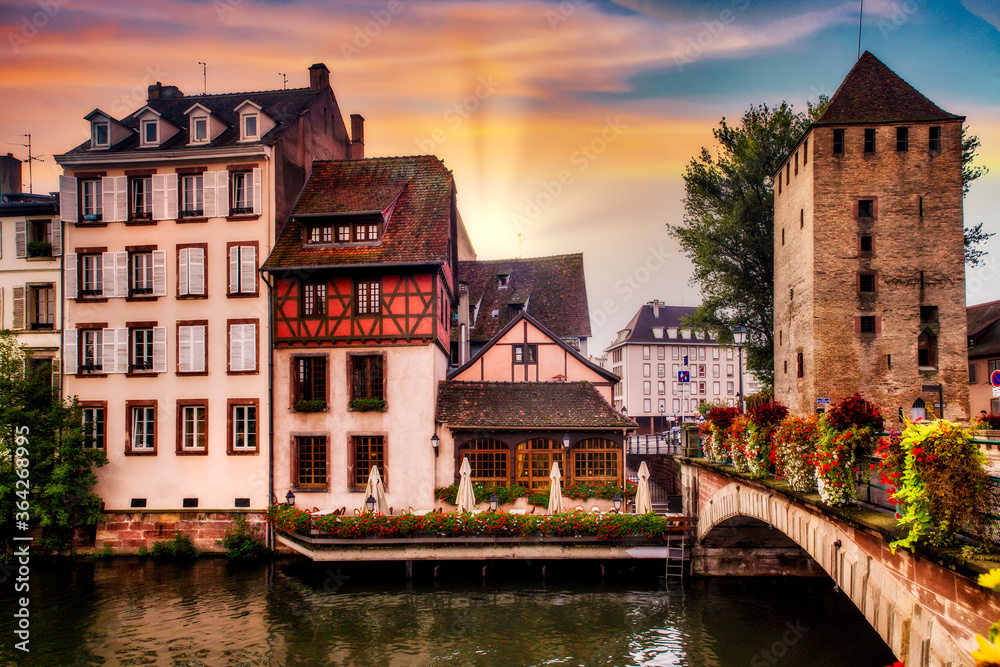 Beautiful view of Strasbourg France at sunset with half timbered architecture and canal in view