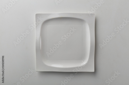 Top view shot of a squarish plate on white background.
