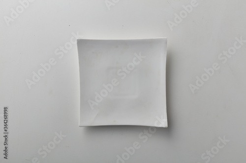 Top view shot of a squarish plate on white background. photo