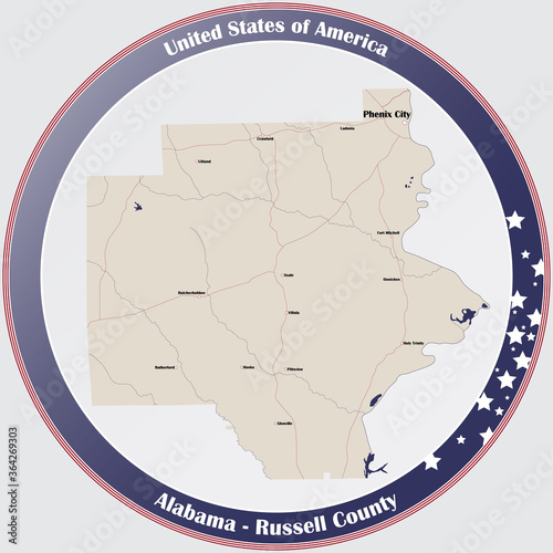 Round button with detailed map of Russell county in Alabama, USA.