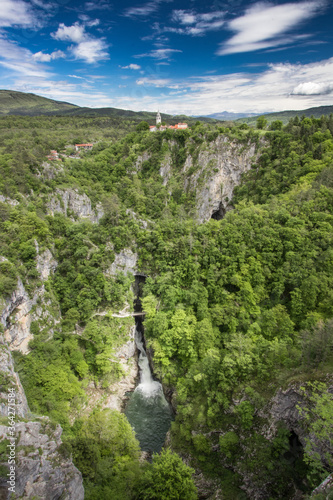 Škocjan caves Slovenia church Reka river water stream waterfall green spring foliage