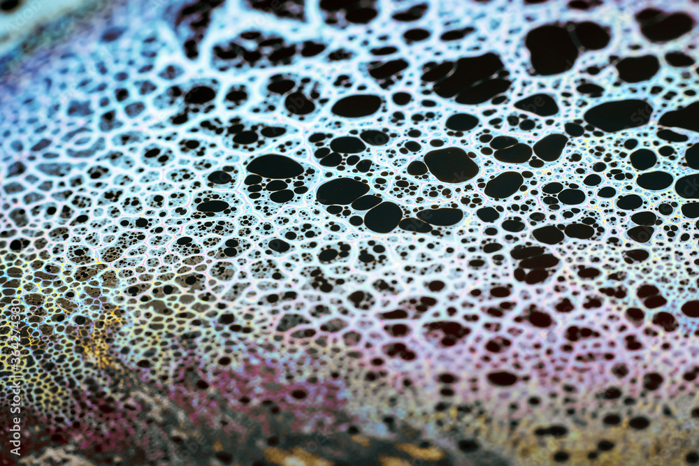 Beautiful psychedelic abstraction formed by light on the surface of a soap bubble Beautiful psychedelic abstraction formed by light on the surface of a soap bubble