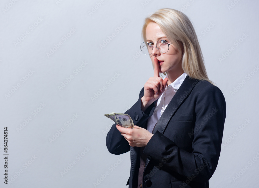 Beautiful blonde businesswoman in suit with money Beautiful blonde businesswoman in suit with money