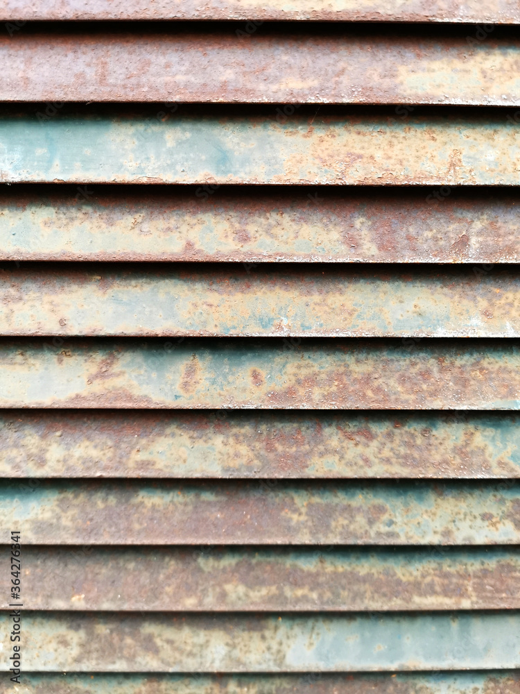 Old rusty iron slide door mesh for background