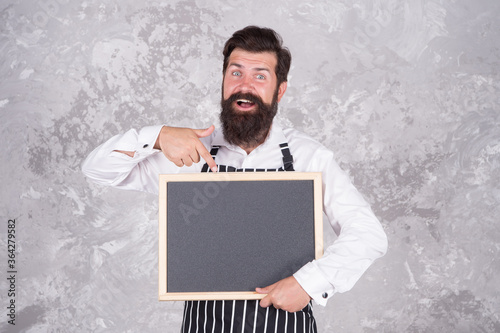 come here. presenting product. best chef menu. chalkboard with copy space for text. professional baker in apron. happy barista with beard. advertisement and food. cook show empty board