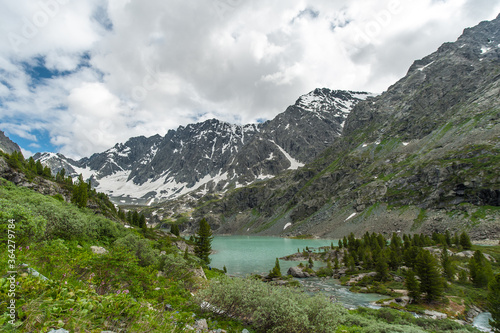 Turquoise lakes in the Altai Mountains and blue sky in the clouds of nature