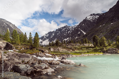 lakes against the backdrop of the Altai Mountains, blue sky with clouds